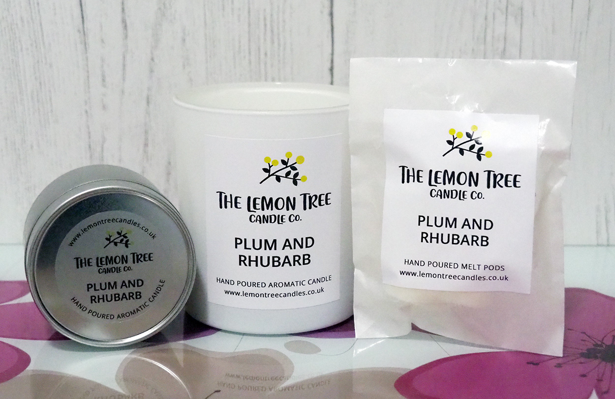 The Lemon Tree Candle Co. candle in a tin, large candle and wax melt pods.