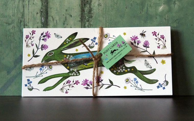 Floral Spring Hare Postcards tied with string.