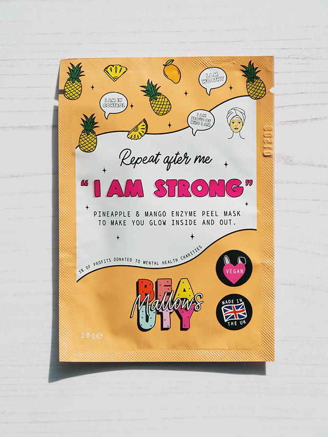 Pineapple & Mango Enzyme Peel Mask with "Repeat after me I AM STRONG" slogan.