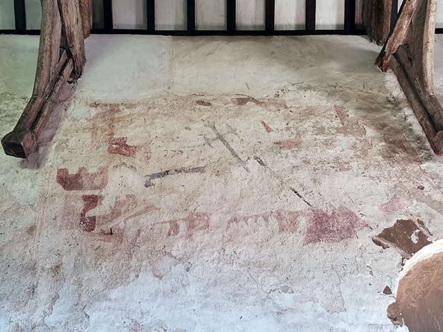 An uncovered medieval wall painting.