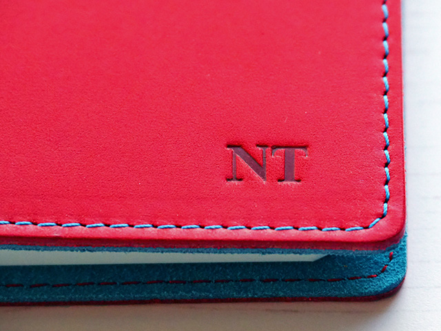 My initials monogrammed on the notebook cover.