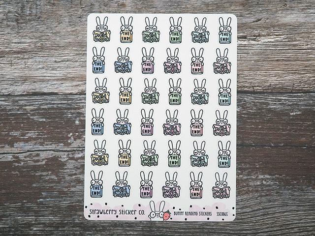 A sheet of stickers showing a cute bunny reading.