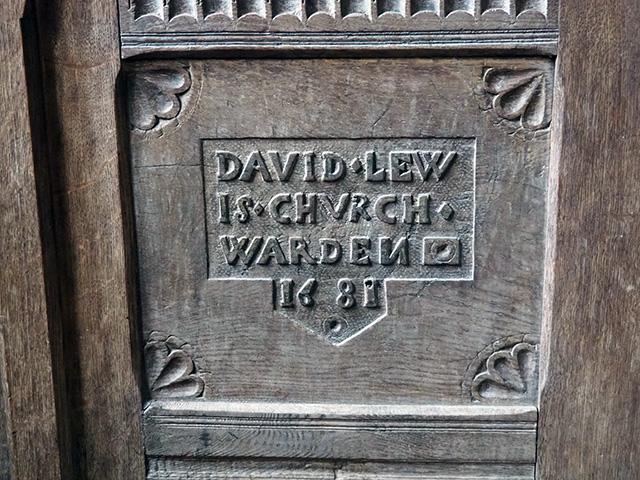 A 17th-century box pew dedicated to David Lewis, Churchwarden, in 1681.