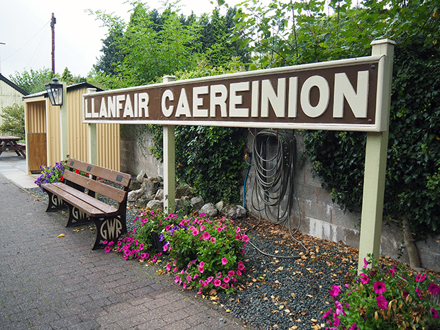 A railway sign reading Llanfair Caereinion.